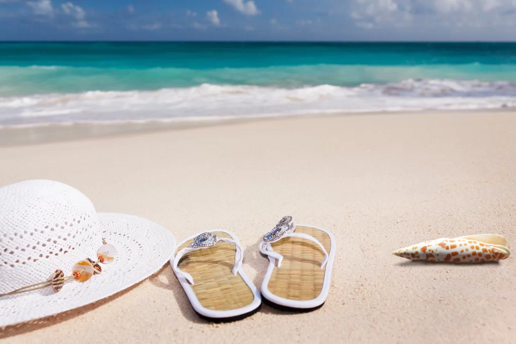 An image of sandals on the beach
