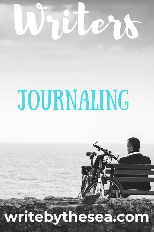 man journaling by the beach 