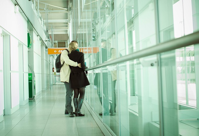 coupling hugging at airport